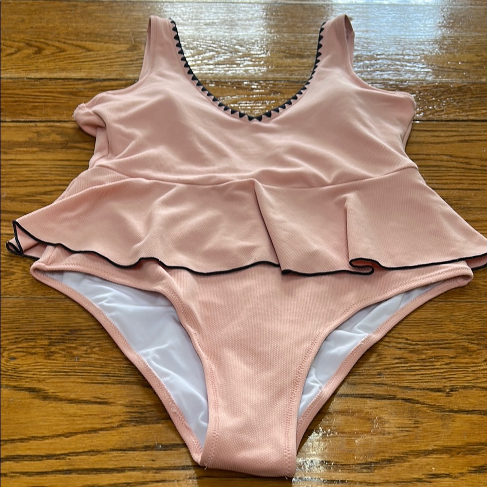 Cup She pink one piece swimsuit with navy blue trim.  Size Large.
